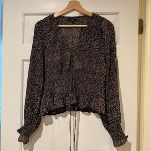 Lucy Paris floral top with waist detail.